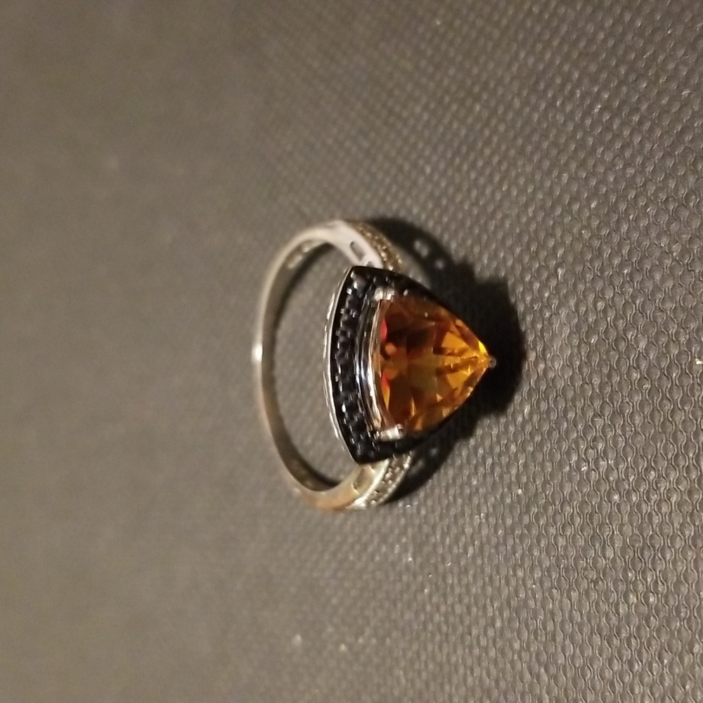Sterling silver ring with amber colored stone